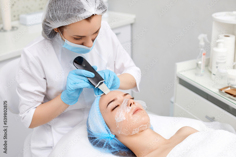 face of woman while procedure ultrasonic cleansing face of woman while procedure ultrasonic cleansing