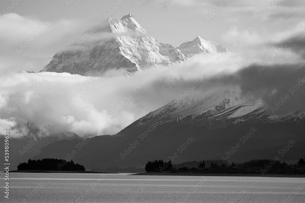 Fototapeta premium Grayscale shot of the snowy alps