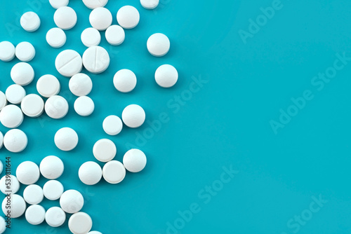 Medical pills on a blue background. Medical preparations. Health