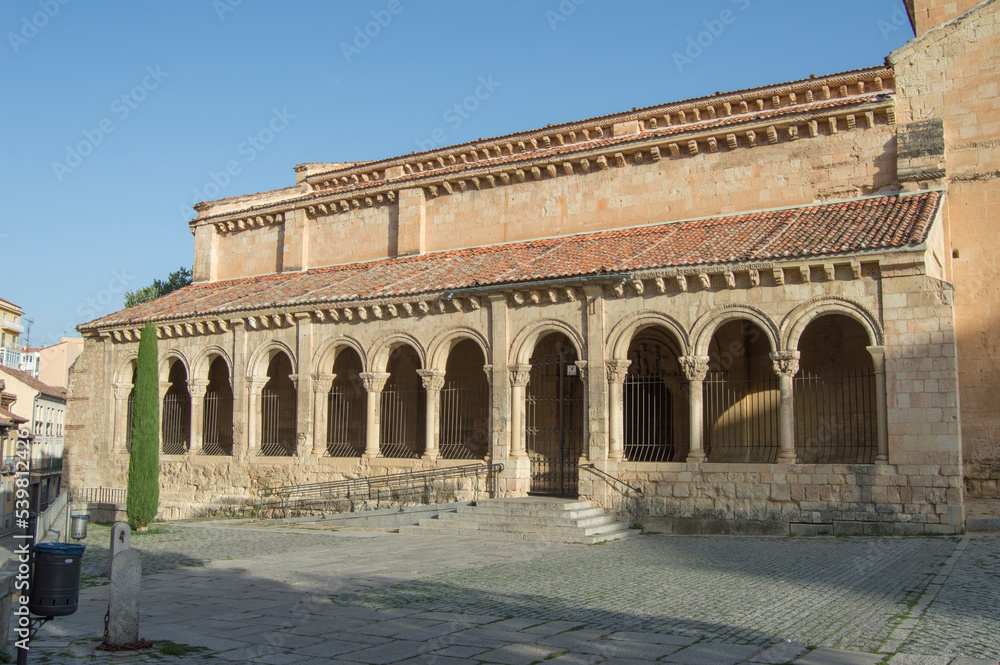 Atrium and entrance with semicircular Romanesque arches of the Romanesque church of San Millán in Segovia. Spain