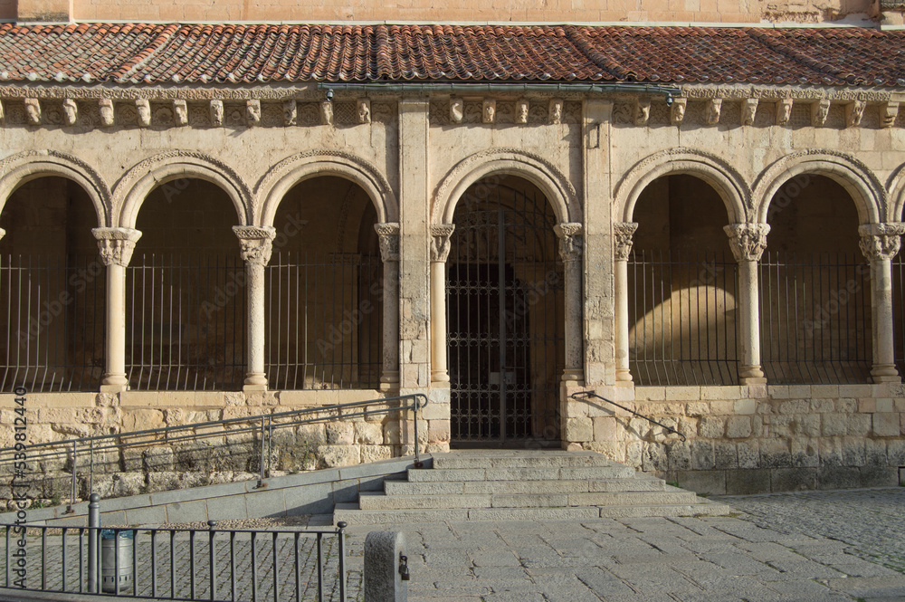 atrium and entrance with Romanesque arches of the church of San Millan in Segovia, Spain, seen from the front