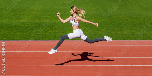 Sportswoman in sportswear jumping. Woman running during. Sport backgrounds. Runner. Professional sportswoman during running training session