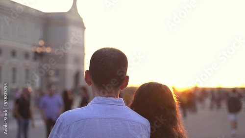 Senior couple travelling in Madrid Royal Palace at sunset
