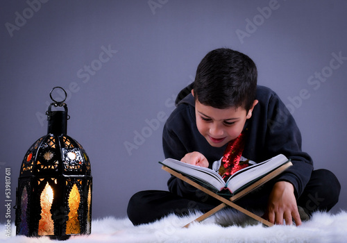 cute Moroccan boy posing in a photography studio.