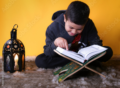 cute Moroccan boy posing in a photography studio.