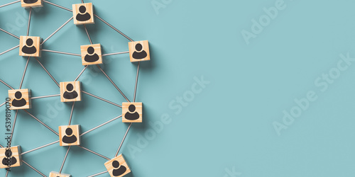 Human resources and team management concept. Wooden blocks with people icon on a blue background. 3D rendering.