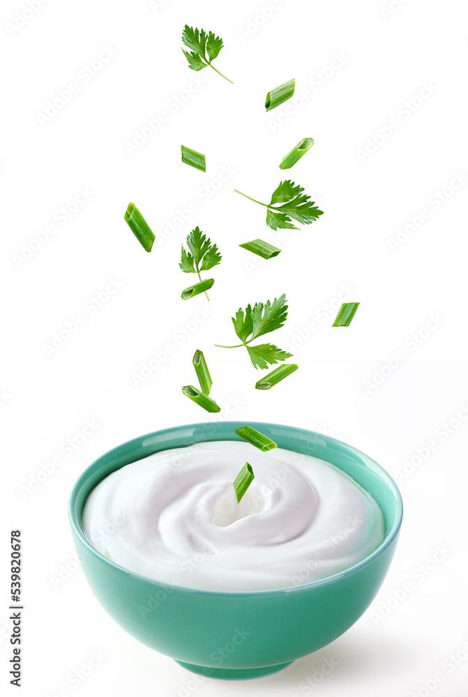 cream sour with greenery in ceramic bowl cream sour with greenery in ceramic bowl