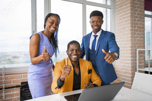 group of african people at work with laptop with hand gesture 