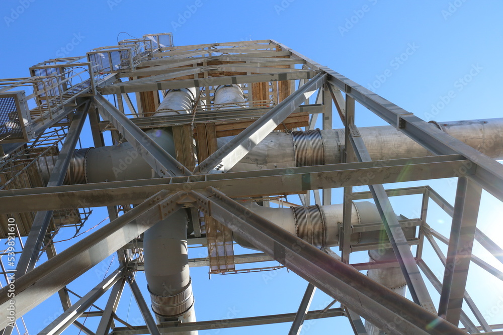 view up to industrial exhaust gas stacks with steel structure view up to industrial exhaust gas stacks with steel structure