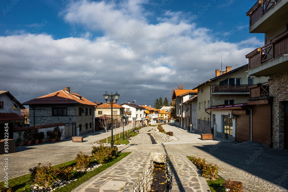 Small bulgarian town in the autumn sunny day. Gotse Delchev street in Bansko, a kempt pedestrian street in city center.