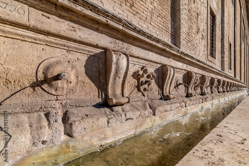 Fountain of the 26 Spouts along the external side of the Basilica of Santa Maria degli Angeli, Assisi, Italy