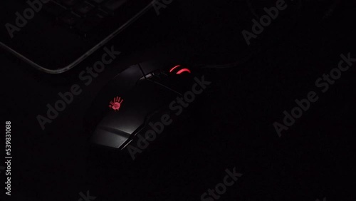 Minsk, Belarus - October 20, 2022: A4Tech mouse. hand rests on a computer mouse photo