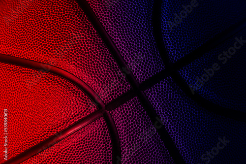 Closeup detail of basketball ball texture background. Neon banner art concept. Horizontal sport theme poster, greeting cards, headers, website and app © Augustas Cetkauskas