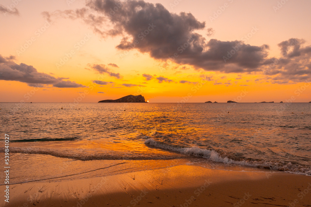 Beautiful sunset by the sea at Cala Comte beach on the island of Ibiza. Balearic