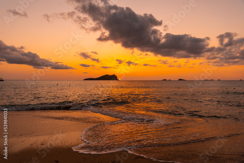 Obraz na płótnie Beautiful sunset by the sea at Cala Comte beach on the island of Ibiza