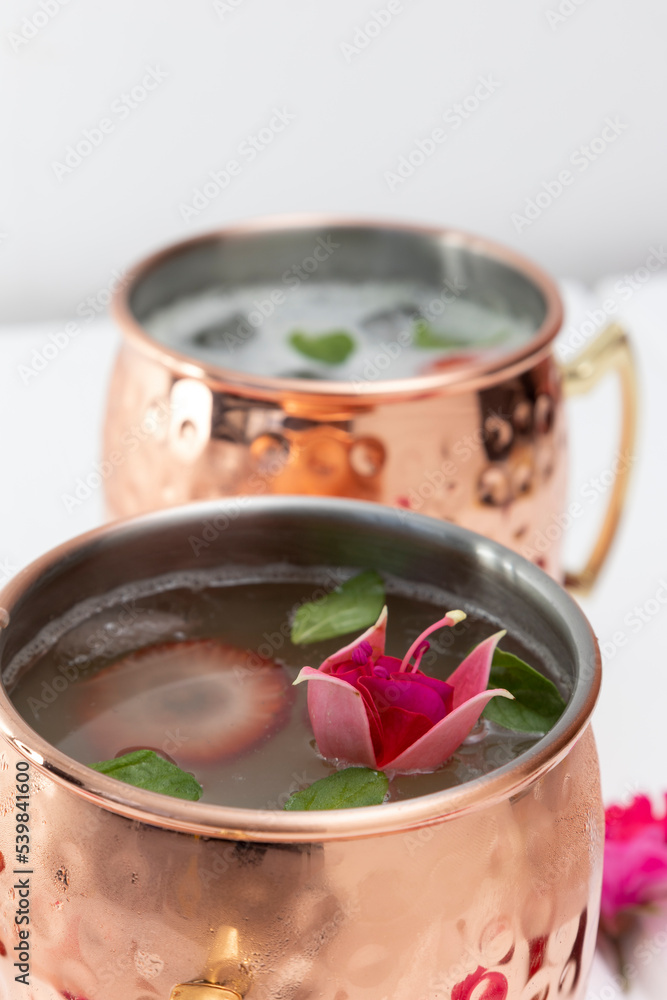 approach to glass with cold drink, decorated with natural flowers in studio, kitchen decoration objects, textures and wallpaper approach to glass with cold drink, decorated with natural flowers in studio, kitchen decoration objects, textures and wallpaper