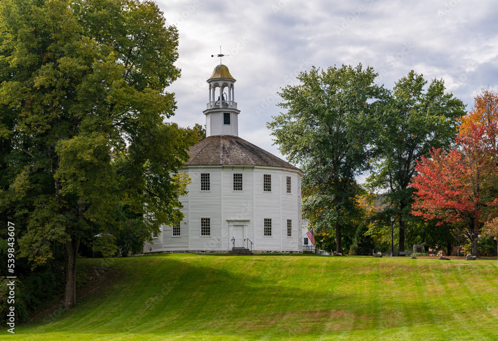 White old round church in the Vermont town of Richmond in the fall