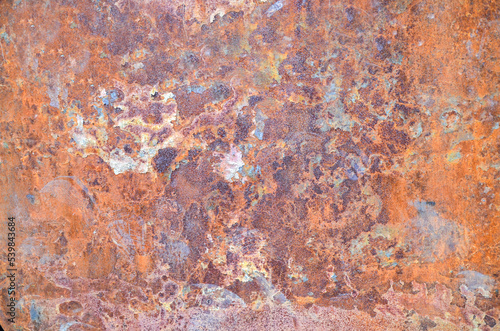Dark worn rusty metal texture or background with paint residues and rust spots. © Dmytro