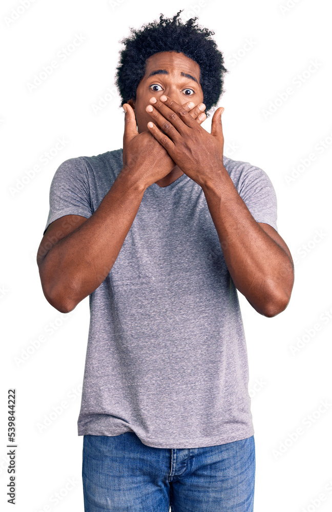 Handsome african american man with afro hair wearing casual clothes shocked covering mouth with hands for mistake. secret concept. Handsome african american man with afro hair wearing casual clothes shocked covering mouth with hands for mistake. secret concept.
