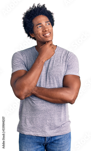 Fotografie, Obraz Handsome african american man with afro hair wearing casual clothes with hand on chin thinking about question, pensive expression