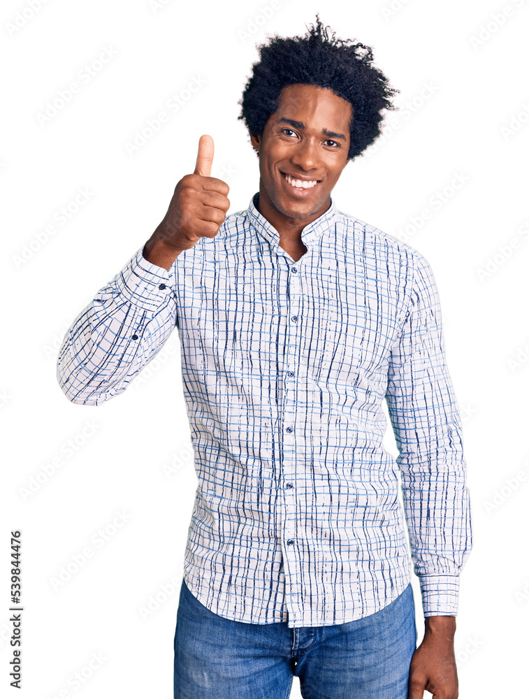 Handsome african american man with afro hair wearing casual clothes smiling happy and positive, thumb up doing excellent and approval sign Handsome african american man with afro hair wearing casual clothes smiling happy and positive, thumb up doing excellent and approval sign