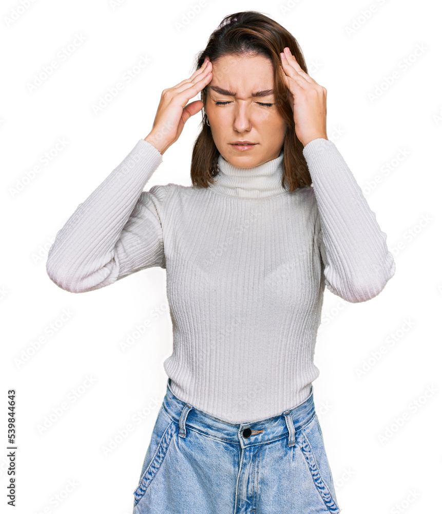 Naklejka premium Young caucasian girl wearing casual clothes with hand on head for pain in head because stress. suffering migraine.