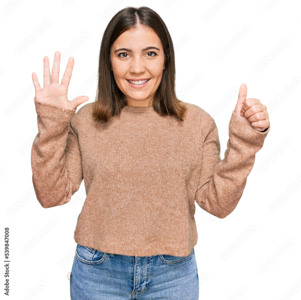 Young beautiful woman wearing casual clothes showing and pointing up with fingers number six while smiling confident and happy. Young beautiful woman wearing casual clothes showing and pointing up with fingers number six while smiling confident and happy.
