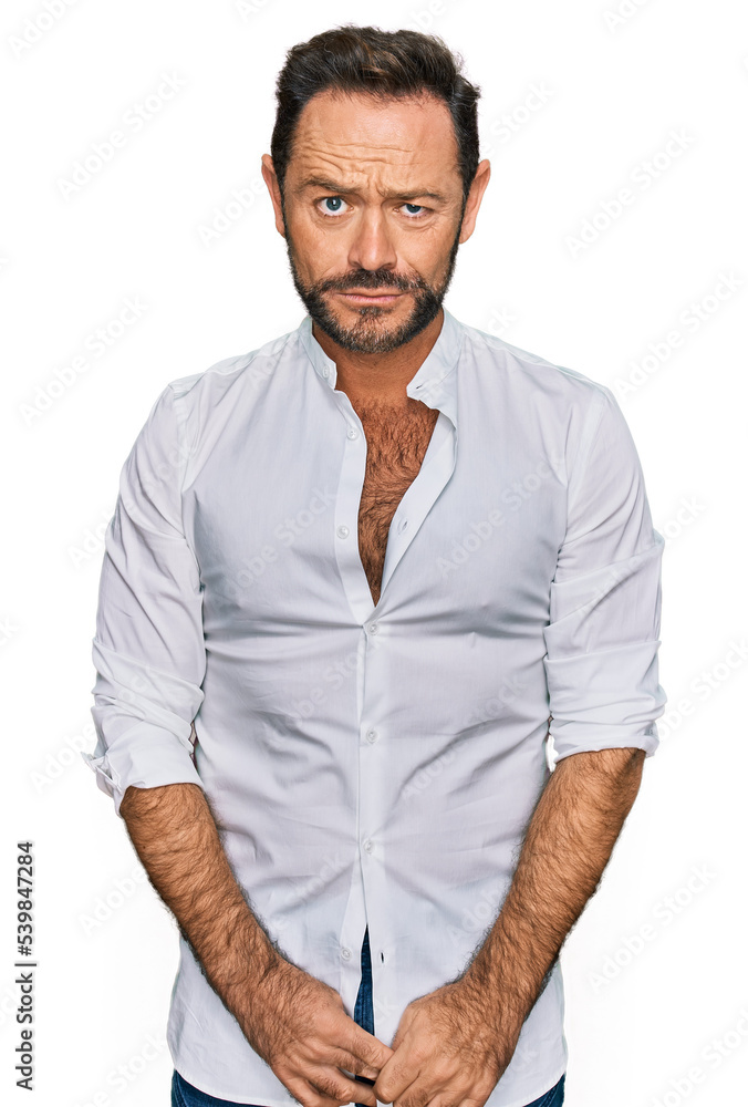 Fototapeta premium Middle age man wearing casual clothes depressed and worry for distress, crying angry and afraid. sad expression.