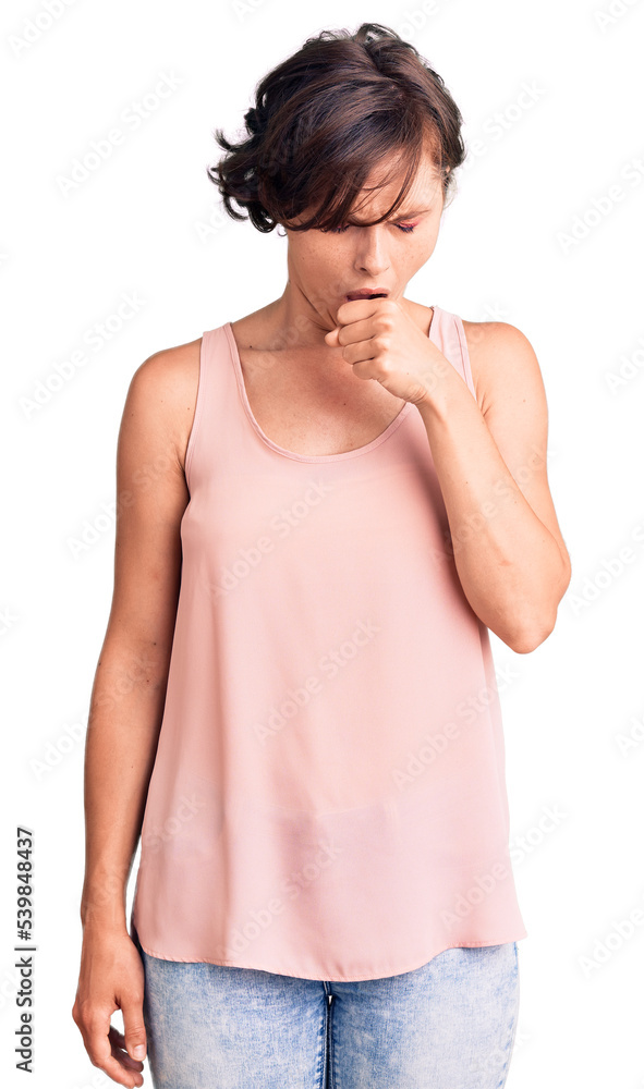 Beautiful young woman with short hair wearing casual style with sleeveless shirt feeling unwell and coughing as symptom for cold or bronchitis. health care concept. Beautiful young woman with short hair wearing casual style with sleeveless shirt feeling unwell and coughing as symptom for cold or bronchitis. health care concept.
