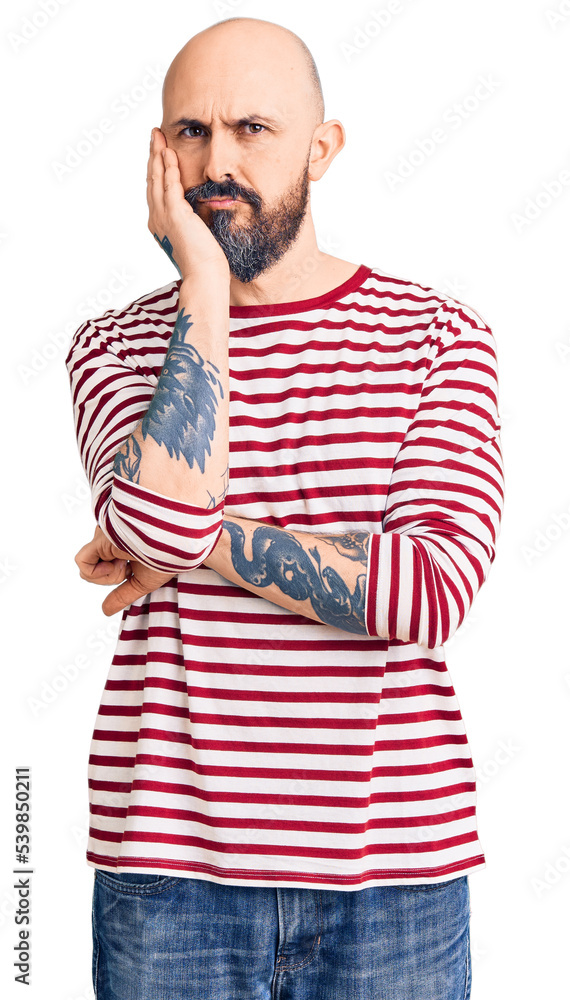 Young handsome man wearing casual clothes thinking looking tired and bored with depression problems with crossed arms. Young handsome man wearing casual clothes thinking looking tired and bored with depression problems with crossed arms.