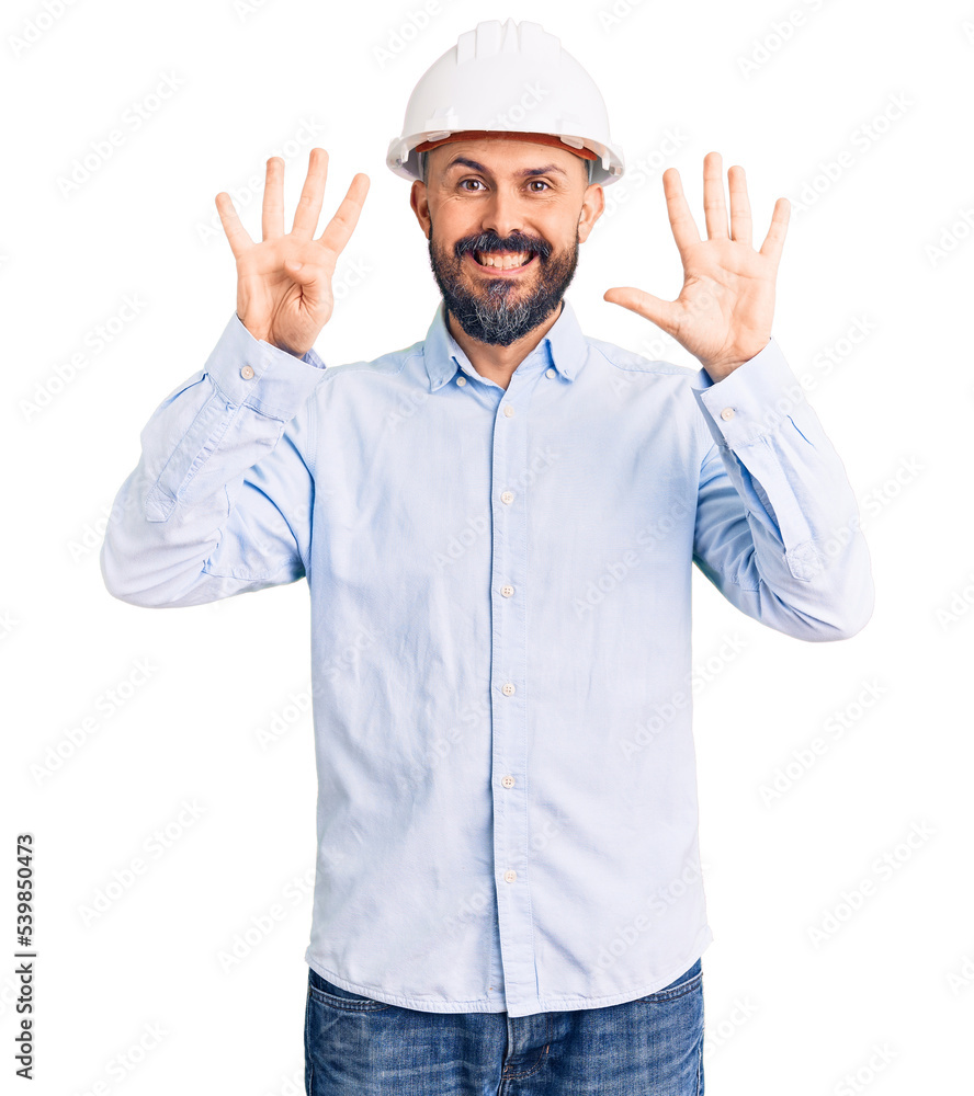 Young handsome man wearing architect hardhat showing and pointing up with fingers number nine while smiling confident and happy. Young handsome man wearing architect hardhat showing and pointing up with fingers number nine while smiling confident and happy.