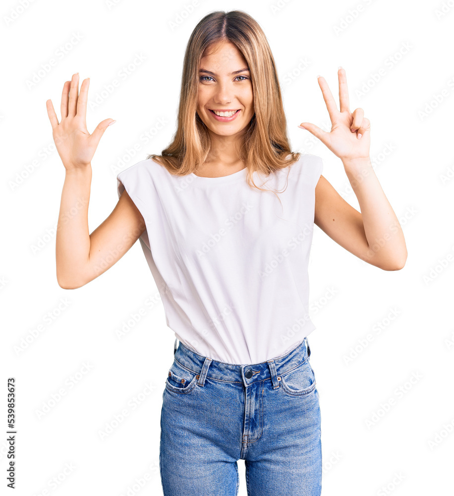 Beautiful caucasian woman with blonde hair wearing casual white tshirt showing and pointing up with fingers number eight while smiling confident and happy. Beautiful caucasian woman with blonde hair wearing casual white tshirt showing and pointing up with fingers number eight while smiling confident and happy.