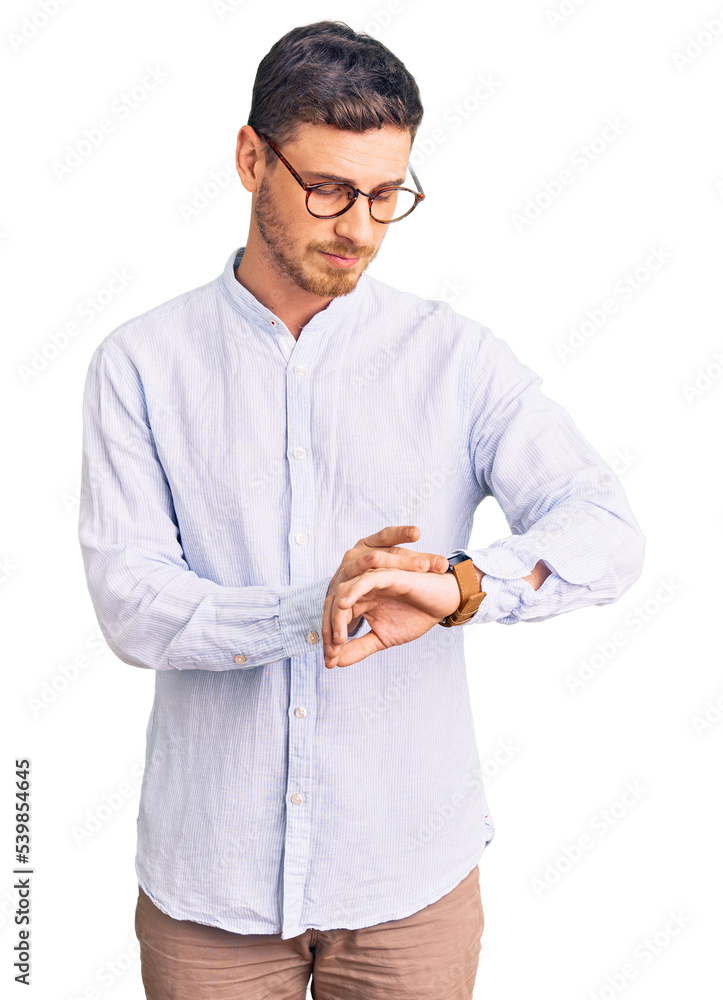 Handsome young man with bear wearing elegant business shirt and glasses checking the time on wrist watch, relaxed and confident Handsome young man with bear wearing elegant business shirt and glasses checking the time on wrist watch, relaxed and confident