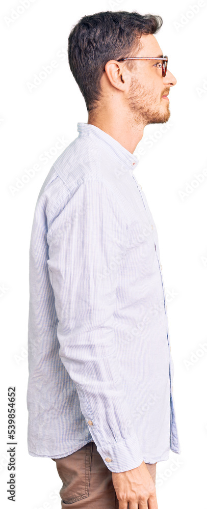 Handsome young man with bear wearing elegant business shirt and glasses looking to side, relax profile pose with natural face and confident smile. Handsome young man with bear wearing elegant business shirt and glasses looking to side, relax profile pose with natural face and confident smile.