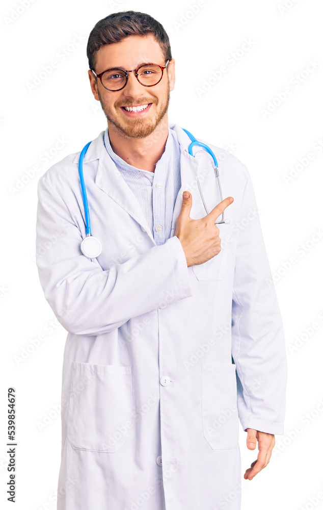 Handsome young man with bear wearing doctor uniform cheerful with a smile of face pointing with hand and finger up to the side with happy and natural expression on face Handsome young man with bear wearing doctor uniform cheerful with a smile of face pointing with hand and finger up to the side with happy and natural expression on face