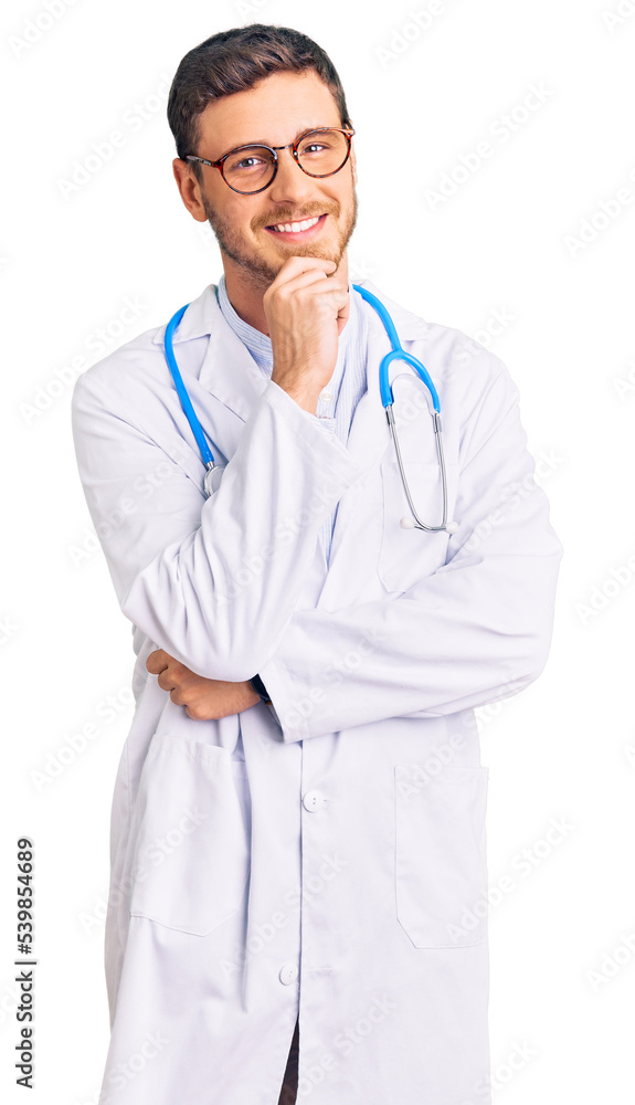 Handsome young man with bear wearing doctor uniform looking confident at the camera with smile with crossed arms and hand raised on chin. thinking positive. Handsome young man with bear wearing doctor uniform looking confident at the camera with smile with crossed arms and hand raised on chin. thinking positive.