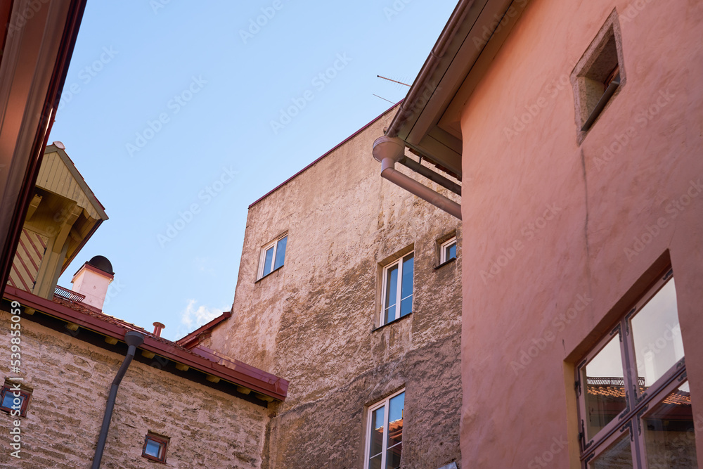Walls and roofs of old medieval houses in the old town in Tallinn, Estonia.