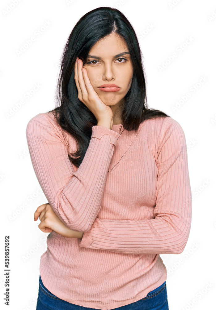 Young hispanic woman wearing casual clothes thinking looking tired and bored with depression problems with crossed arms. Young hispanic woman wearing casual clothes thinking looking tired and bored with depression problems with crossed arms.