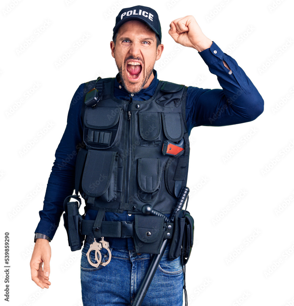 Young handsome man wearing police uniform angry and mad raising fist frustrated and furious while shouting with anger. rage and aggressive concept. Young handsome man wearing police uniform angry and mad raising fist frustrated and furious while shouting with anger. rage and aggressive concept.