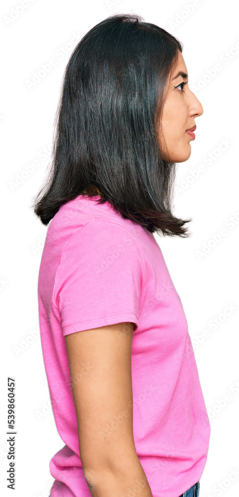 Beautiful asian young woman wearing casual pink t shirt looking to side, relax profile pose with natural face with confident smile. Beautiful asian young woman wearing casual pink t shirt looking to side, relax profile pose with natural face with confident smile.