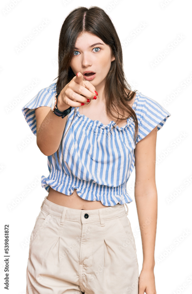 Young beautiful caucasian girl wearing casual clothes pointing displeased and frustrated to the camera, angry and furious with you Young beautiful caucasian girl wearing casual clothes pointing displeased and frustrated to the camera, angry and furious with you