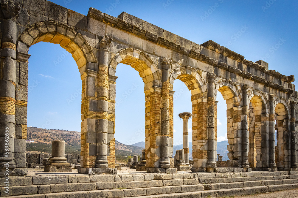 roman forum ruins, arches, volubilis, morocco, north africa
