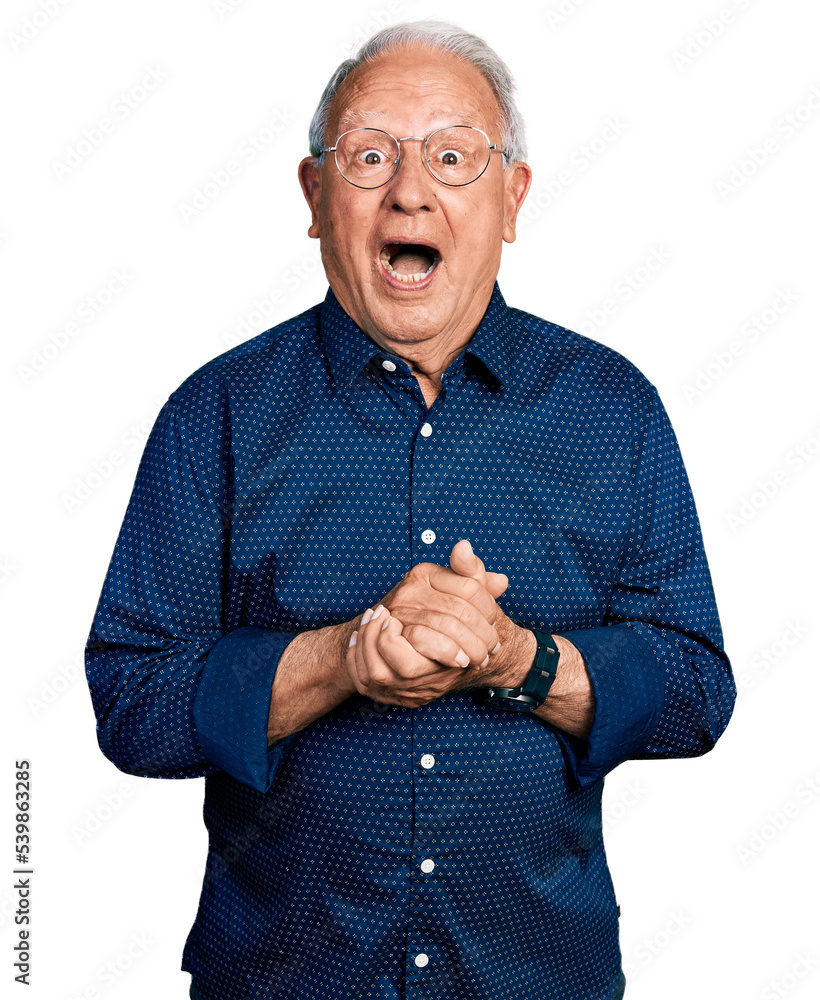 Senior man with grey hair holding hands together celebrating crazy and amazed for success with open eyes screaming excited. Senior man with grey hair holding hands together celebrating crazy and amazed for success with open eyes screaming excited.