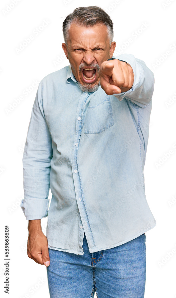 Middle age grey-haired man wearing casual clothes pointing displeased and frustrated to the camera, angry and furious with you Middle age grey-haired man wearing casual clothes pointing displeased and frustrated to the camera, angry and furious with you