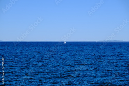 Sailboat in the distance on Lake Ontario
