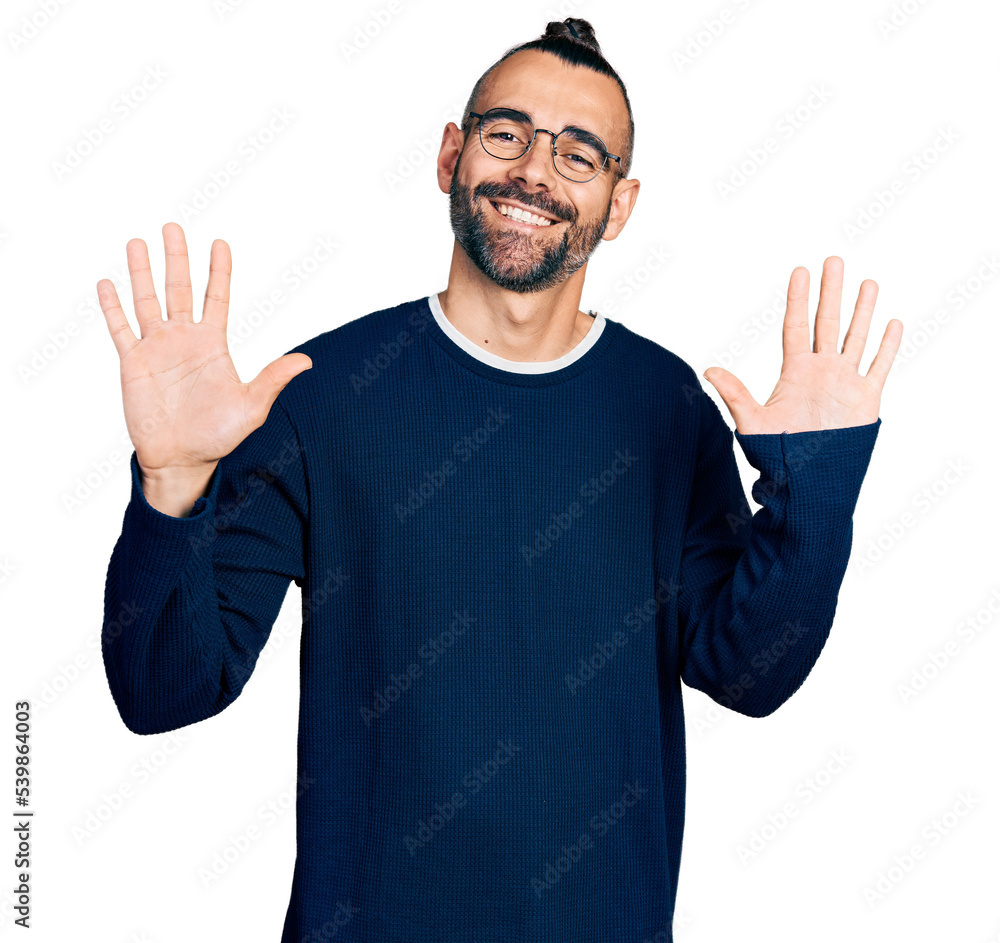 Hispanic man with ponytail wearing casual sweater and glasses showing and pointing up with fingers number ten while smiling confident and happy. Hispanic man with ponytail wearing casual sweater and glasses showing and pointing up with fingers number ten while smiling confident and happy.