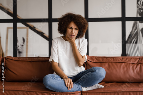 Free Download Sick african girl touches throat with pain. Laryngitis first symptoms throat ache. Seasonal illness medecine. - GFXLoad