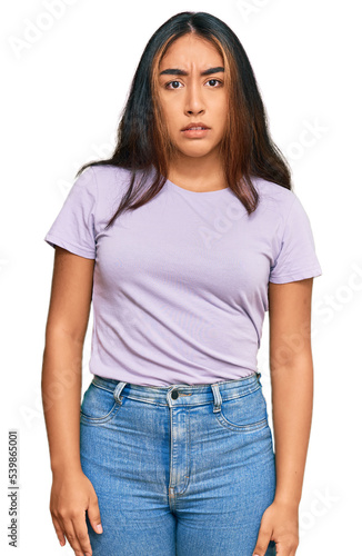 Young latin woman wearing casual clothes skeptic and nervous, frowning upset because of problem. negative person.