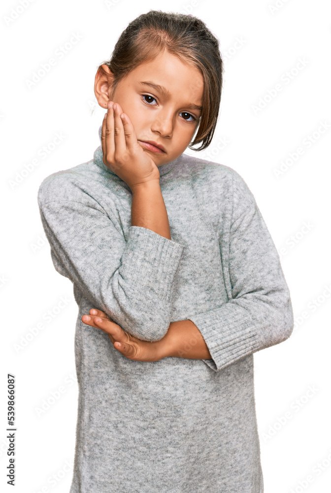 Little beautiful girl wearing casual turtleneck sweater thinking looking tired and bored with depression problems with crossed arms. Little beautiful girl wearing casual turtleneck sweater thinking looking tired and bored with depression problems with crossed arms.