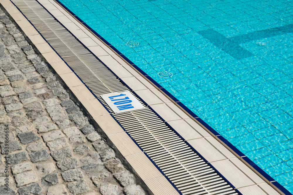 Obraz premium Detail of outdoor swimming pool filled with water closeup